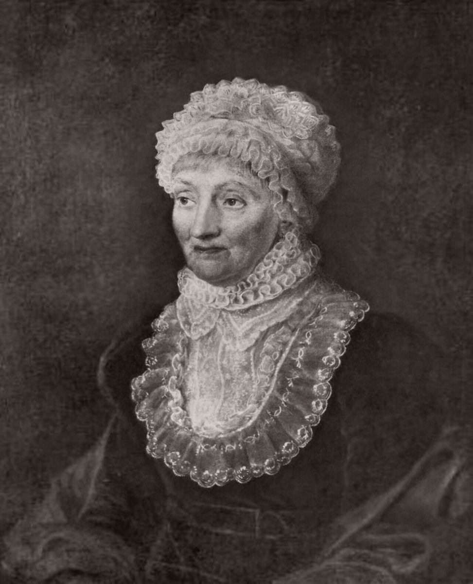 A portrait of an elderly Caroline Herschel in a lace bonnet and ruffled collar.