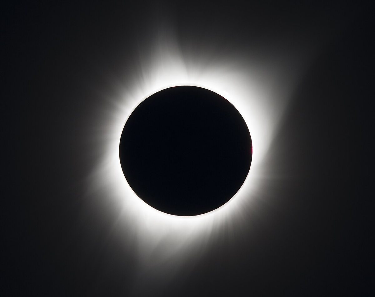 The totally eclipsed Sun on 21 August 2017, a black disc surrounded by the white streamers of the corona.