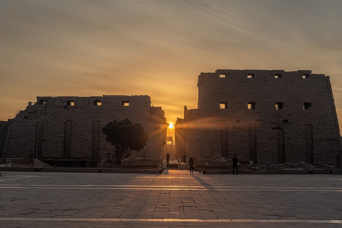 The rising Sun shines through the gateway of Karnak's first pylon on the winter solstice.