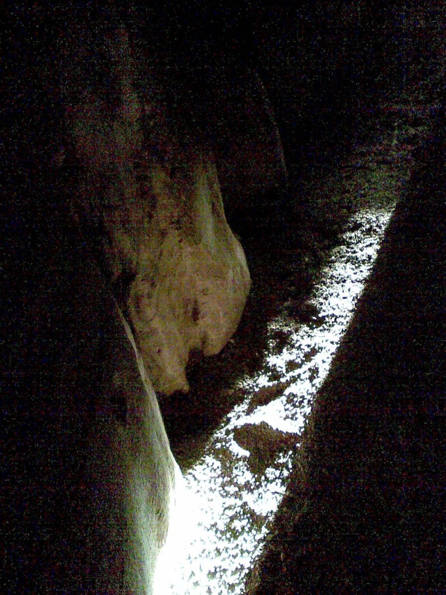 A shaft of winter solstice sunlight lights the floor of the stone passage inside Newgrange.