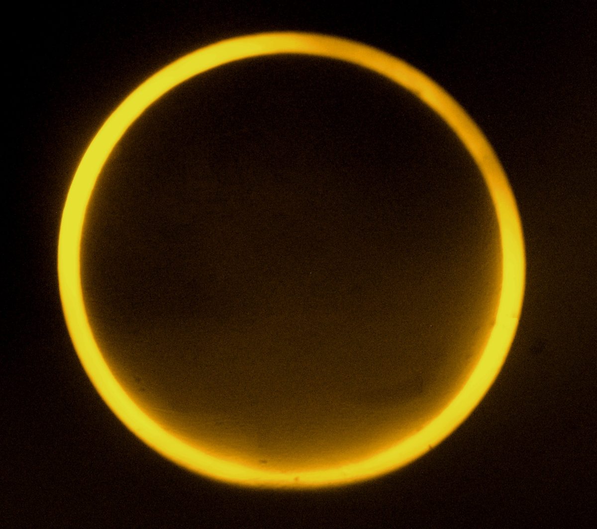 The Moon sits inside the Sun's disc, leaving a thin bright ring of fire around its dark edge.